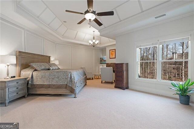carpeted bedroom with visible vents, crown molding, a decorative wall, a tray ceiling, and ceiling fan with notable chandelier