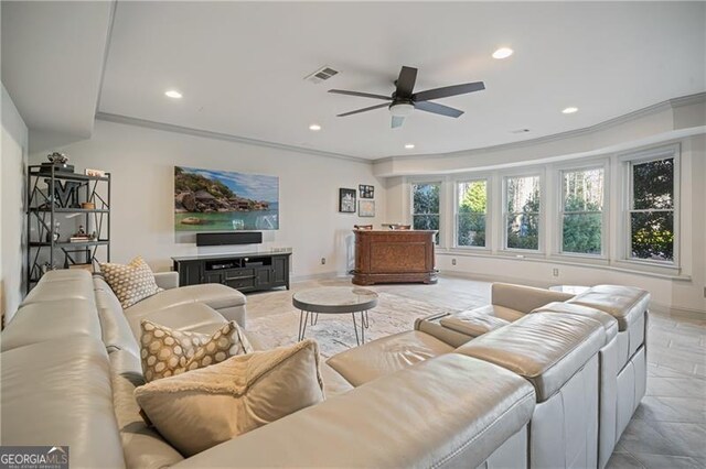 living area with crown molding, visible vents, baseboards, ceiling fan, and recessed lighting