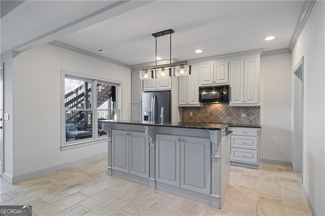 kitchen with stainless steel fridge, ornamental molding, black microwave, and tasteful backsplash
