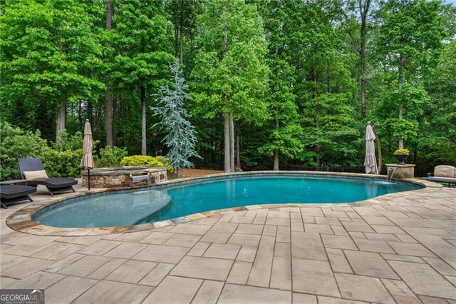 outdoor pool with a patio