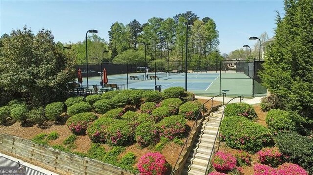 view of sport court with fence