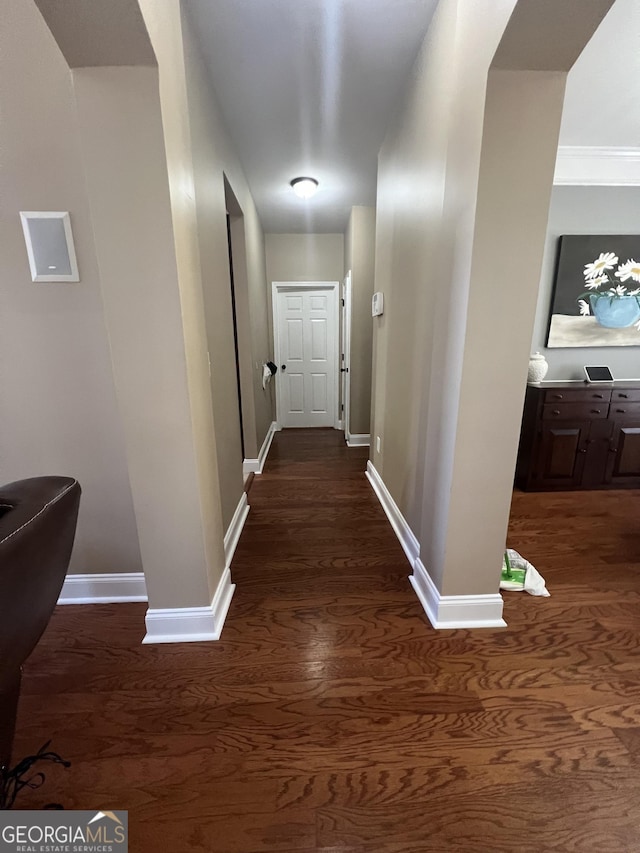 2973 Red Fox Dr, Haddock, GA 31033 - hallway featuring dark wood-style flooring and baseboards