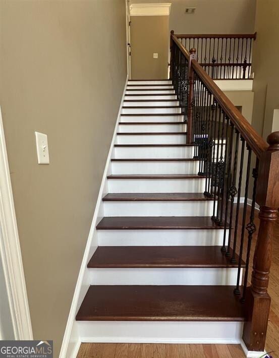 2973 Red Fox Dr, Haddock, GA 31033 - stairway with baseboards
