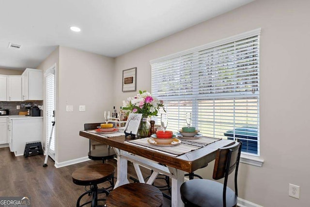 7178 Cavender Dr SW, Atlanta, GA 30331 - dining room featuring dark wood finished floors, baseboards, visible vents, and recessed lighting