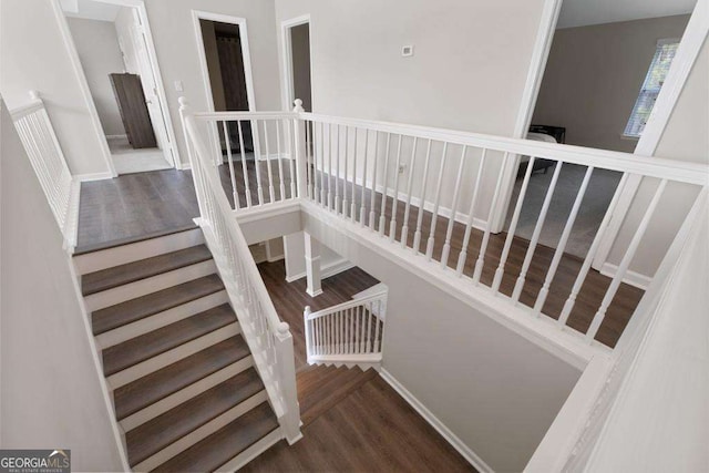 7178 Cavender Dr SW, Atlanta, GA 30331 - staircase featuring baseboards and wood finished floors
