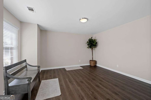 7178 Cavender Dr SW, Atlanta, GA 30331 - unfurnished room with baseboards, visible vents, and wood finished floors