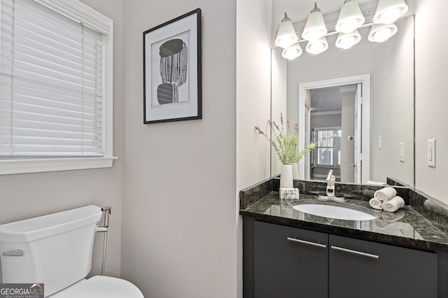 half bath with toilet and vanity