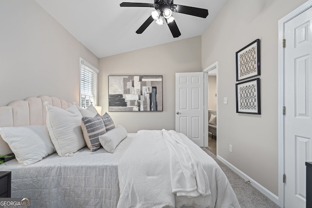 bedroom with baseboards, carpet floors, lofted ceiling, and ceiling fan