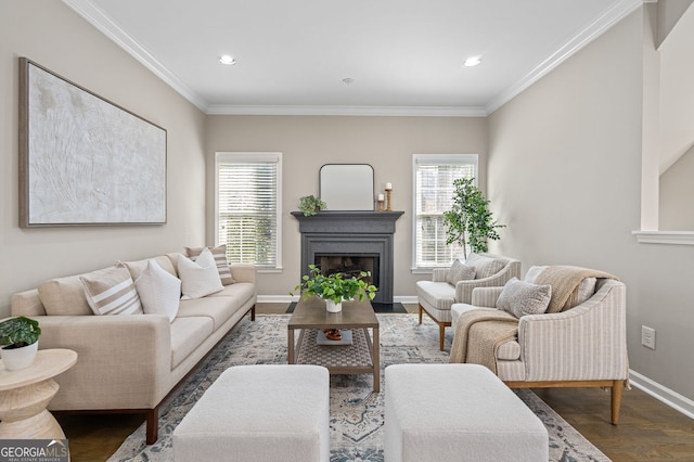 living room with crown molding, baseboards, recessed lighting, a fireplace, and wood finished floors