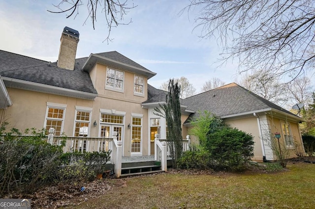 1281 Tanglebrook Dr, Athens, GA 30606 - back of house featuring stucco siding, a chimney, a wooden deck, and a shingled roof