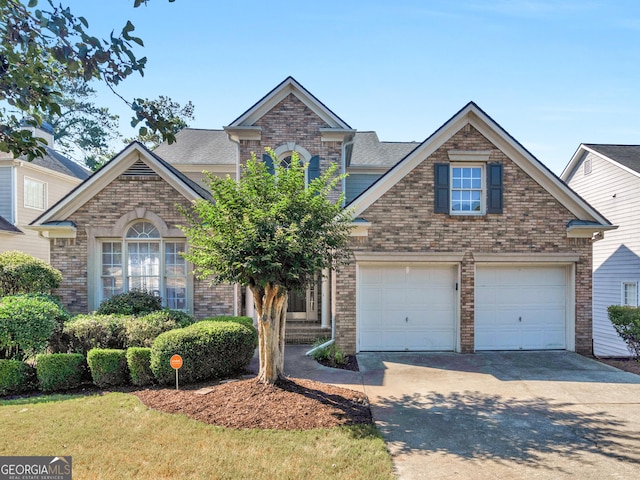152 Vinings Lake Ct SW, Mableton, GA 30126 - view of front of home with brick siding, concrete driveway, and roof with shingles