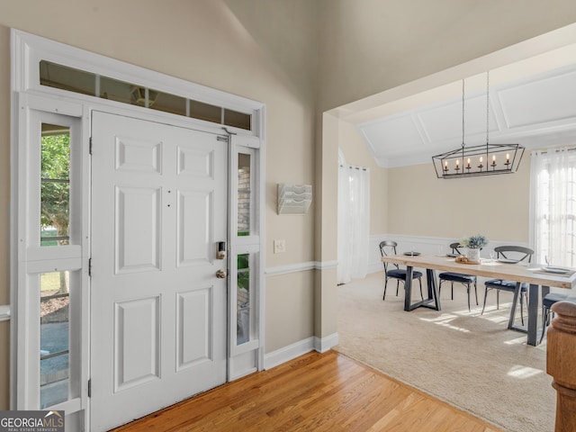 152 Vinings Lake Ct SW, Mableton, GA 30126 - carpeted foyer with baseboards, a notable chandelier, and wood finished floors