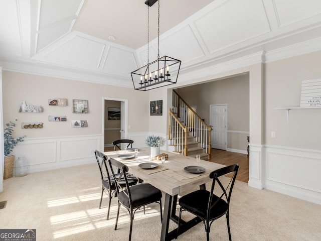152 Vinings Lake Ct SW, Mableton, GA 30126 - dining space featuring an inviting chandelier, light carpet, coffered ceiling, and stairway