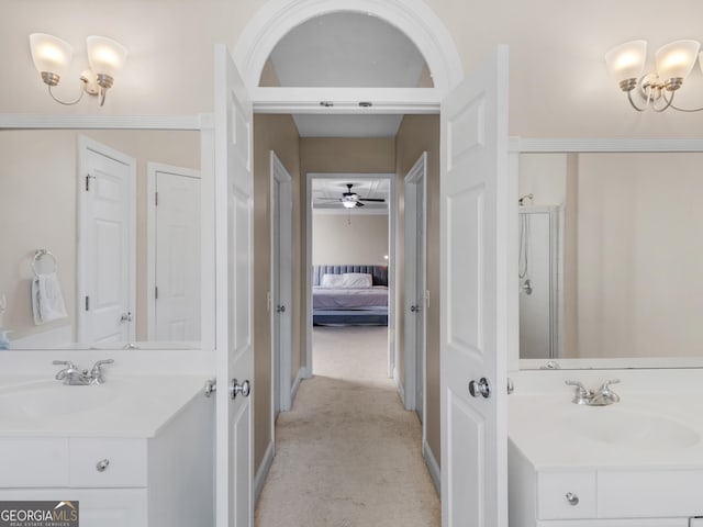 152 Vinings Lake Ct SW, Mableton, GA 30126 - full bathroom featuring vanity, ornamental molding, a shower stall, connected bathroom, and ceiling fan