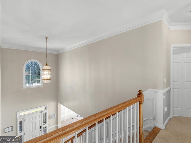 152 Vinings Lake Ct SW, Mableton, GA 30126 - hall featuring an upstairs landing, carpet flooring, ornamental molding, baseboards, and a chandelier