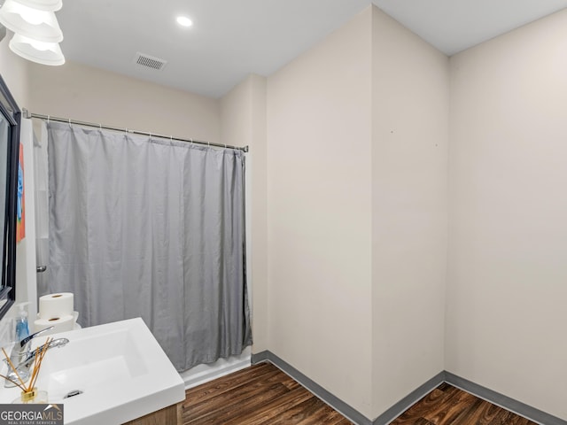 152 Vinings Lake Ct SW, Mableton, GA 30126 - bathroom with vanity, curtained shower, wood finished floors, baseboards, and visible vents