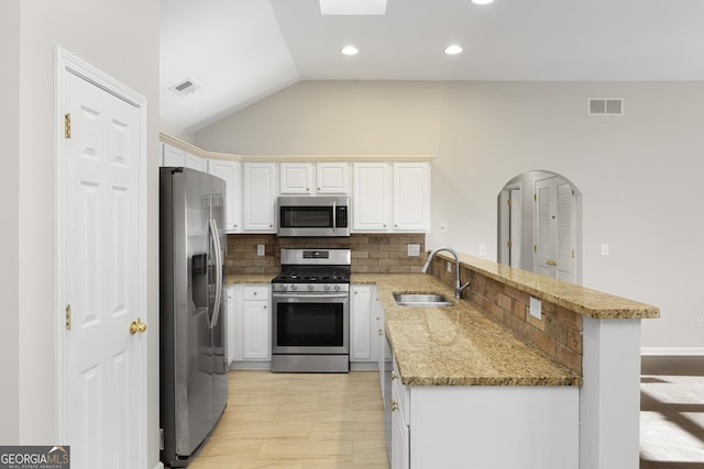 4071 Cottage Oaks Dr Unit 3, Acworth, GA 30101 - kitchen featuring appliances with stainless steel finishes, a sink, a peninsula, decorative backsplash, and white cabinetry