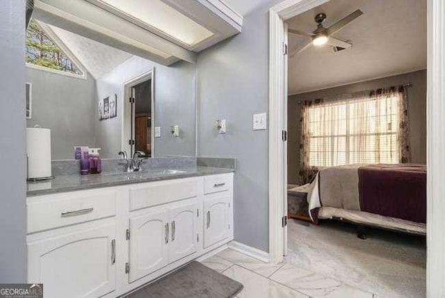 bathroom featuring vanity, a ceiling fan, lofted ceiling, and marble finish floor
