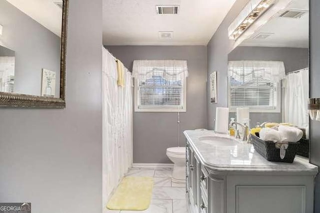 full bath featuring visible vents, marble finish floor, toilet, and vanity