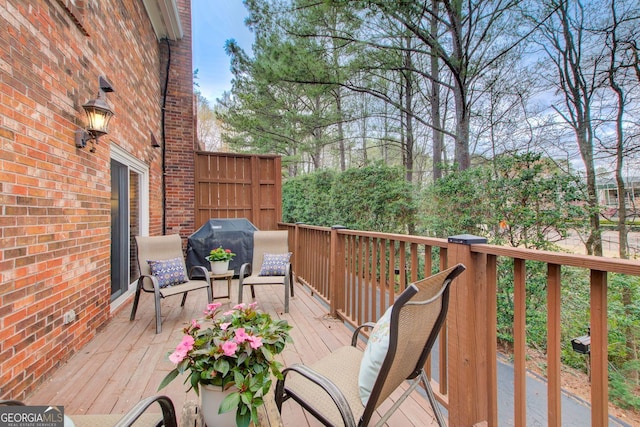 wooden deck featuring grilling area
