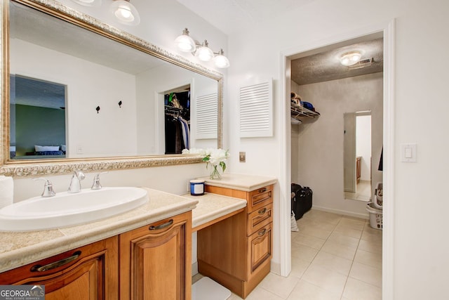 bathroom with visible vents, tile patterned floors, and vanity