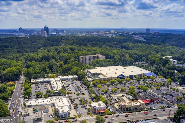 aerial view featuring a city view and a forest view
