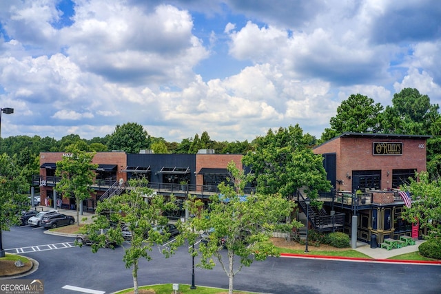 view of property with uncovered parking
