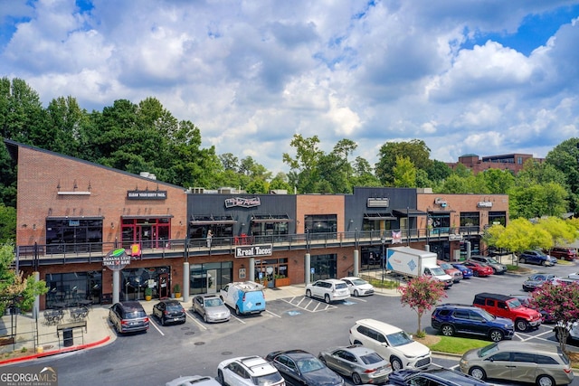 view of property with uncovered parking