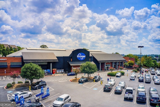 view of building exterior featuring uncovered parking