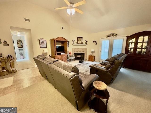 5555 Carlton Ln, Garfield, GA 30425 - living room featuring carpet, a ceiling fan, a fireplace, and high vaulted ceiling