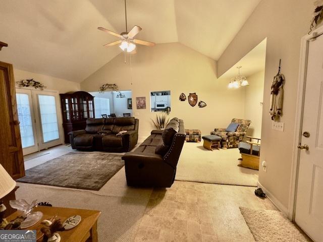 5555 Carlton Ln, Garfield, GA 30425 - living area with ceiling fan, lofted ceiling, carpet floors, and a chandelier
