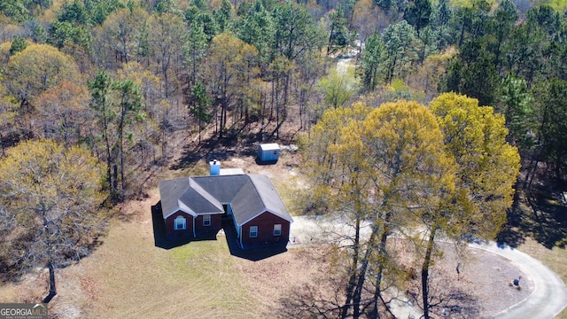 5555 Carlton Ln, Garfield, GA 30425 - aerial view of property and surrounding area with a heavily wooded area