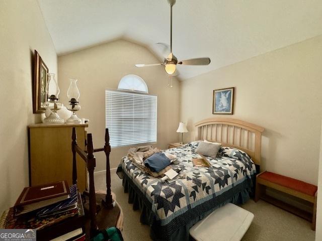 5555 Carlton Ln, Garfield, GA 30425 - carpeted bedroom with lofted ceiling and a ceiling fan