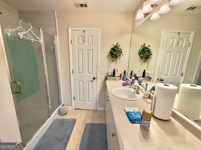 5555 Carlton Ln, Garfield, GA 30425 - full bathroom featuring a stall shower and vanity
