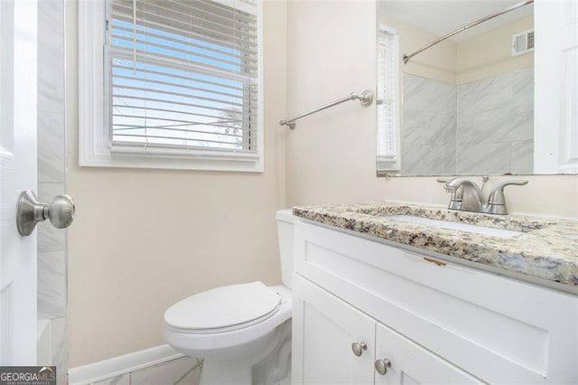 3409 Glensford Dr, Decatur, GA 30032 - full bathroom with a shower, visible vents, toilet, and vanity
