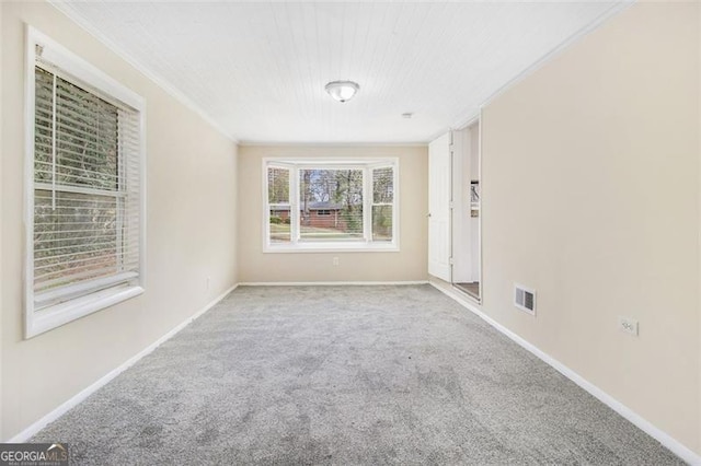 3409 Glensford Dr, Decatur, GA 30032 - carpeted empty room featuring visible vents, crown molding, and baseboards