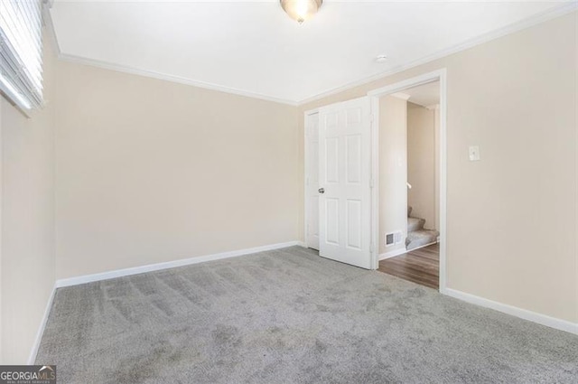 3409 Glensford Dr, Decatur, GA 30032 - interior space featuring crown molding, baseboards, visible vents, and carpet floors