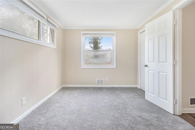 3409 Glensford Dr, Decatur, GA 30032 - unfurnished bedroom featuring visible vents, carpet, and ornamental molding