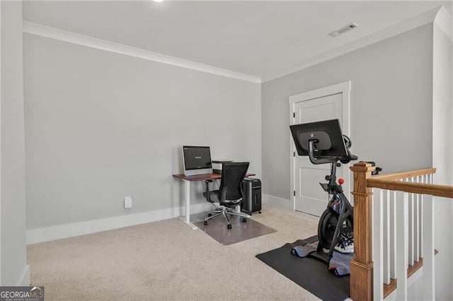 carpeted office with ornamental molding and baseboards