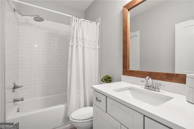 bathroom with toilet, shower / tub combo, and vanity