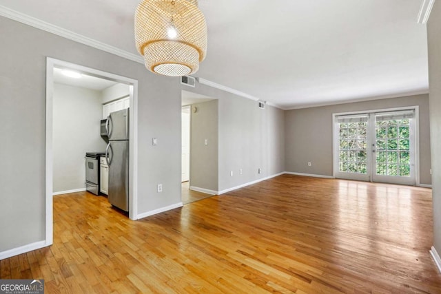 unfurnished living room with crown molding, light wood-style flooring, baseboards, and visible vents