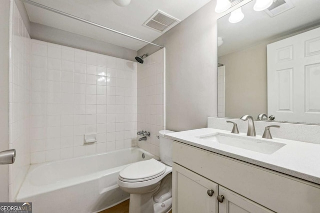 full bathroom featuring visible vents, vanity, toilet, and shower / tub combination