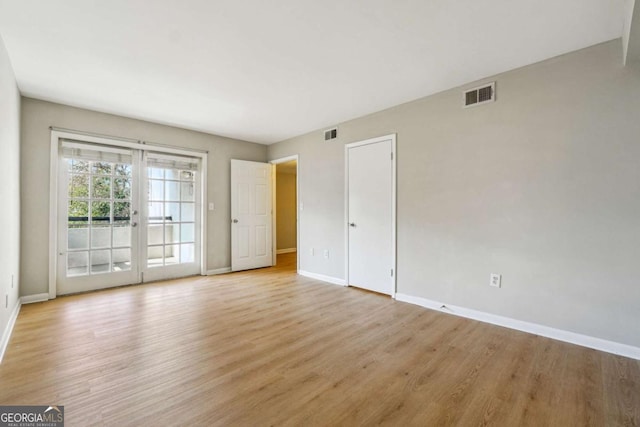 interior space with visible vents, baseboards, and light wood-style flooring