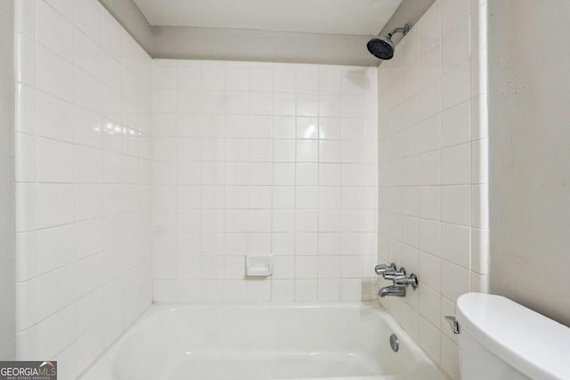 bathroom with toilet and shower / washtub combination