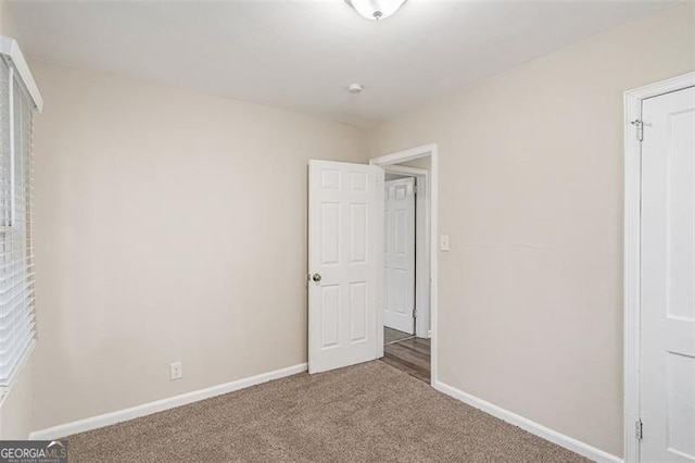 2203 Knoll Dr, Decatur, GA 30032 - unfurnished bedroom with carpet flooring and baseboards
