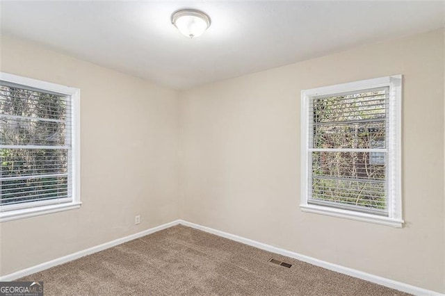 2203 Knoll Dr, Decatur, GA 30032 - spare room with visible vents, baseboards, carpet, and a healthy amount of sunlight