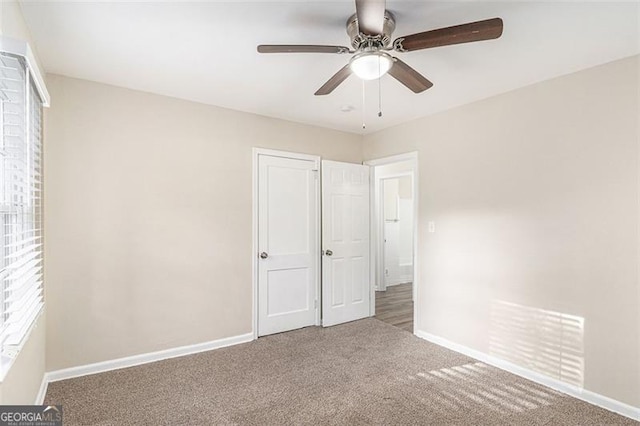 2203 Knoll Dr, Decatur, GA 30032 - unfurnished bedroom featuring baseboards, carpet floors, visible vents, and a ceiling fan