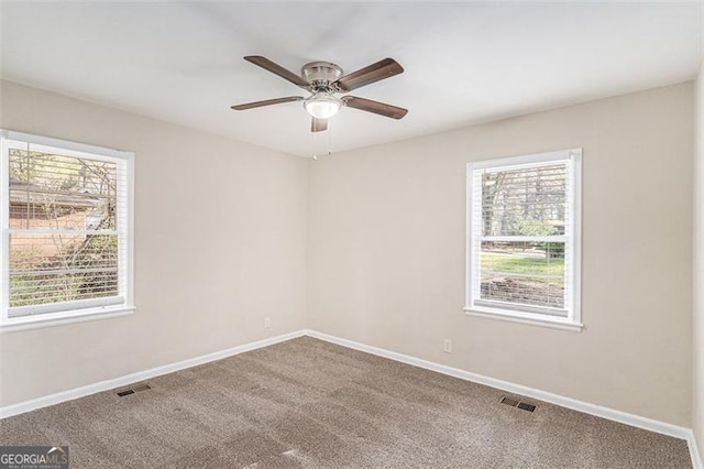 2203 Knoll Dr, Decatur, GA 30032 - spare room with visible vents, a healthy amount of sunlight, and baseboards