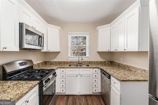 2203 Knoll Dr, Decatur, GA 30032 - kitchen featuring a sink, stainless steel appliances, light stone counters, and white cabinets
