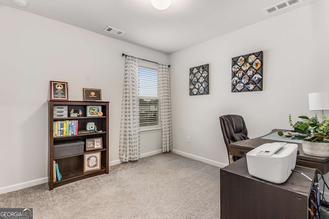 office area with baseboards, visible vents, and carpet flooring